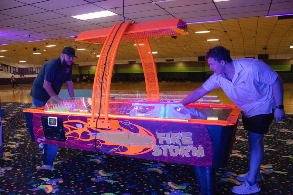 Air hockey game in skating rink