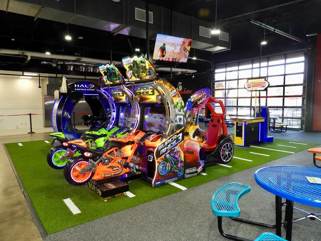 Race car games on green astro turf in garage