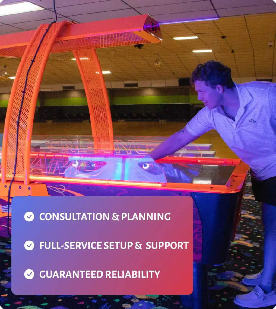Man plays air hockey in a roller skating rink
