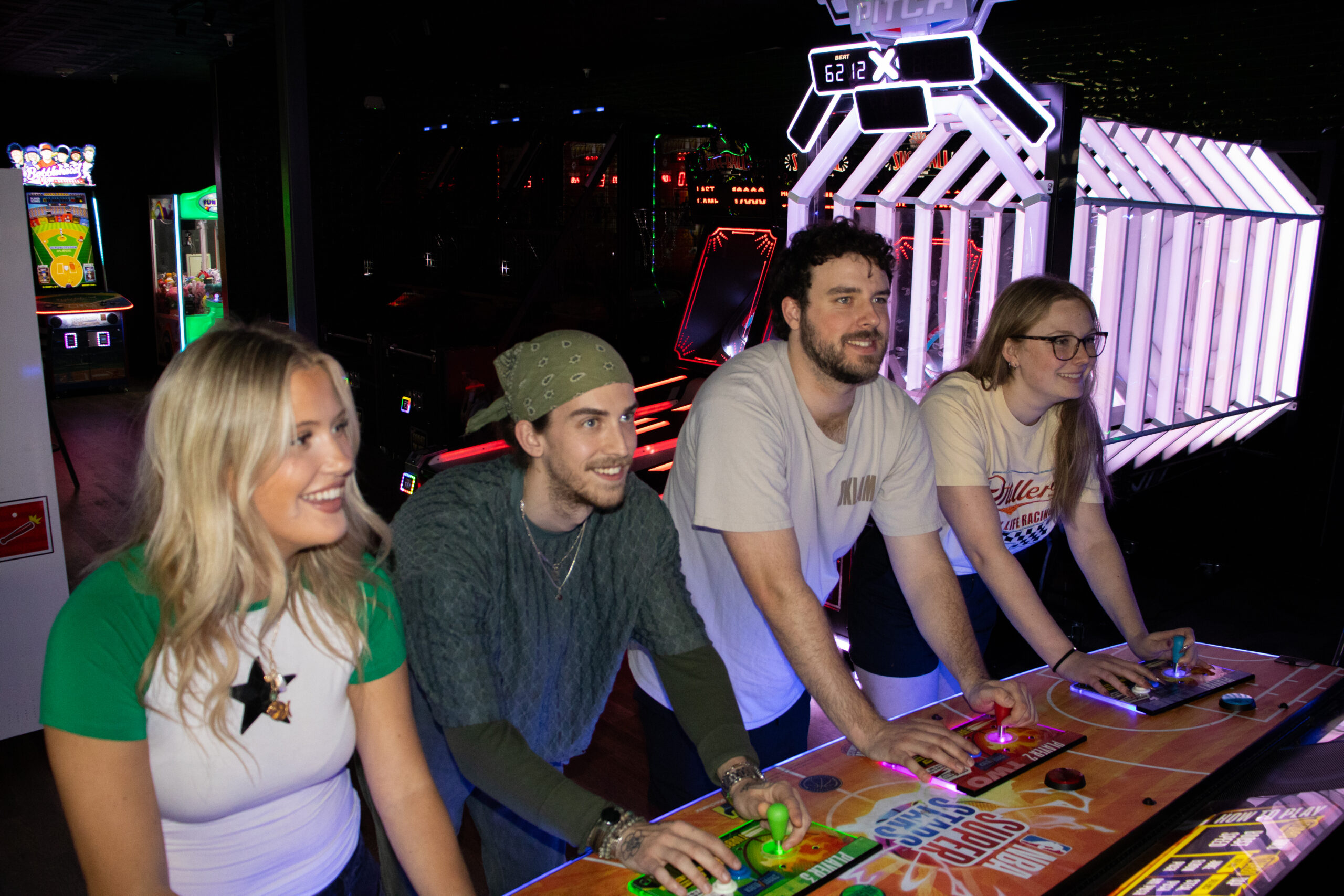 people playing arcade game